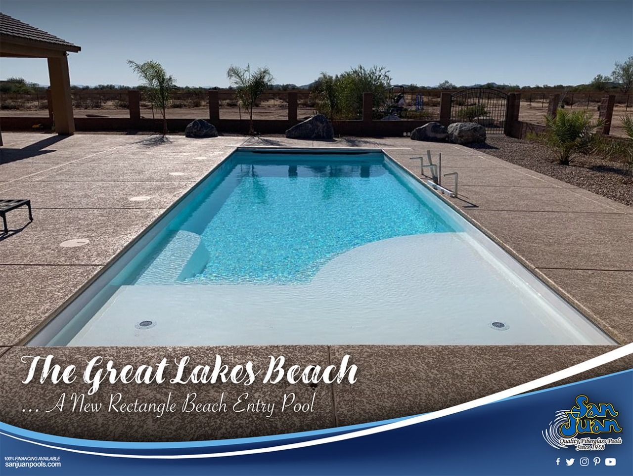 Rectangular outdoor pool at The Great Lakes Beach resort with blue water and desert landscaping