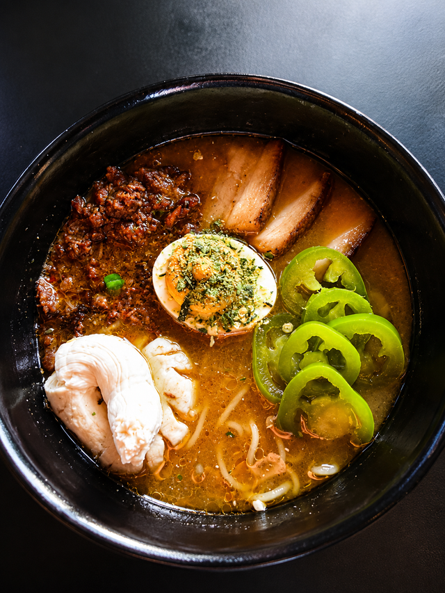 Jalapeño Business ramen bowl with miso broth, pork belly, cream cheese, and pickled jalapeños