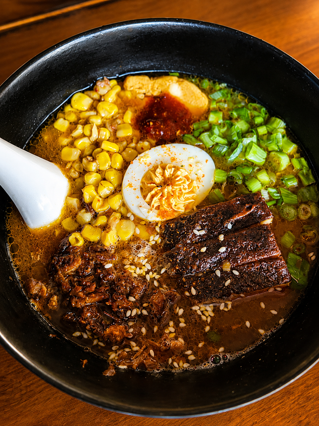 Butter Corn ramen with spicy miso broth, pork belly, corn, and cumin butter