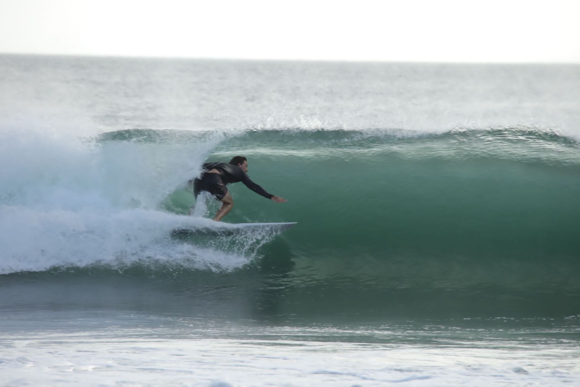 Dark blue surf forecast graphic with centered “SURF” text and small wave rating text.