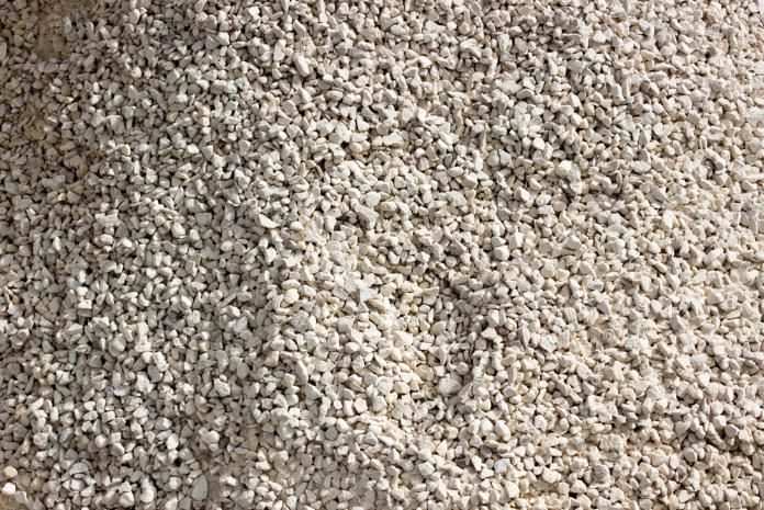 A Pile of White Gravel is Sitting on a Table — Zappala Quarries in Douglas Shire, QLD