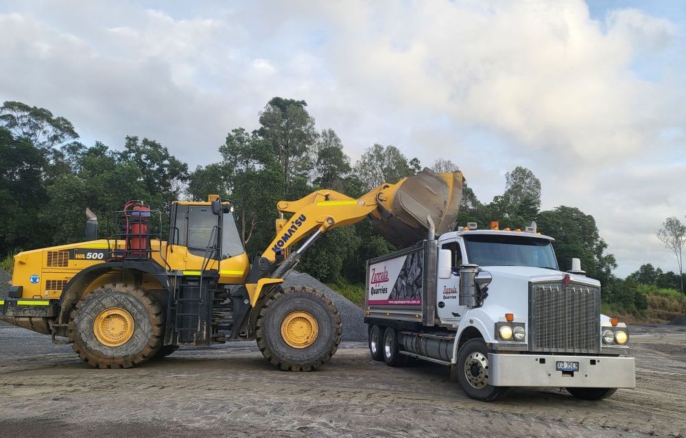 Green Scorpion pugmill and red tracked scalping machine standing by each other— Zappala Quarries in Gordonvale, QLD