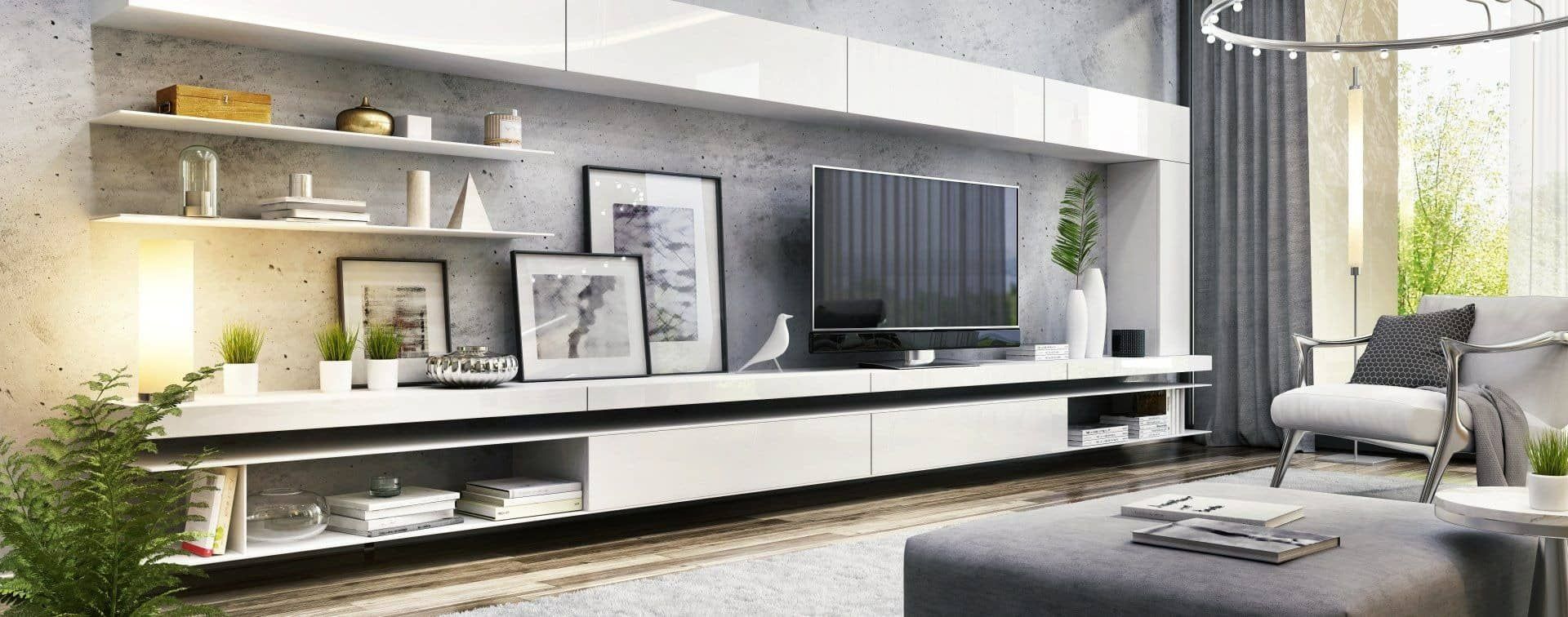 A Living Room With a Television on the Wall and a Couch — Halls Cabinets & Joinery in Harlaxton, QLD