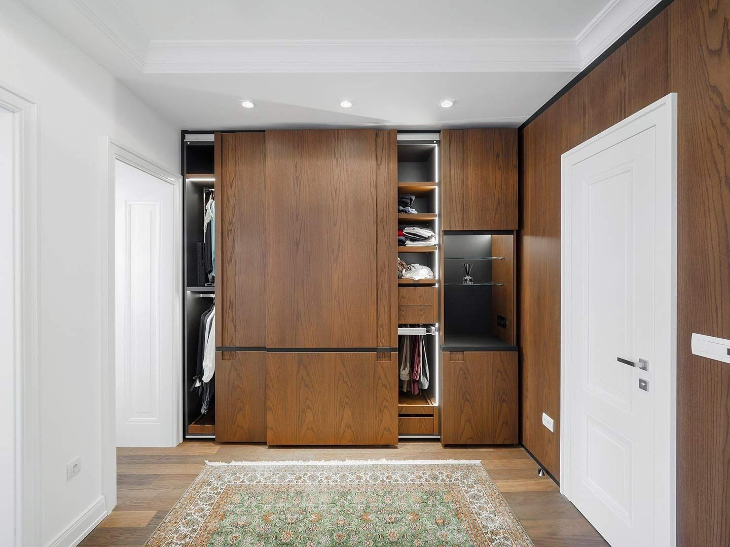 A Bedroom With a Sliding Door Wardrobe and a Rug — Halls Cabinets & Joinery in Harlaxton, QLD