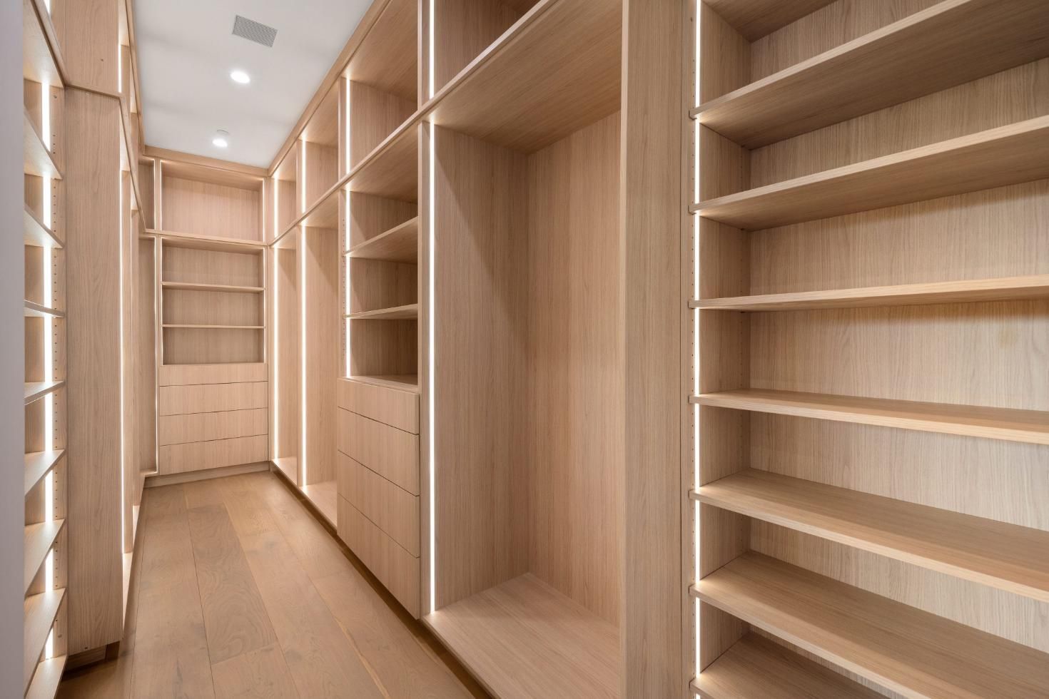 Empty Walk in Closet With Wooden Shelves — Halls Cabinets & Joinery in Harlaxton, QLD