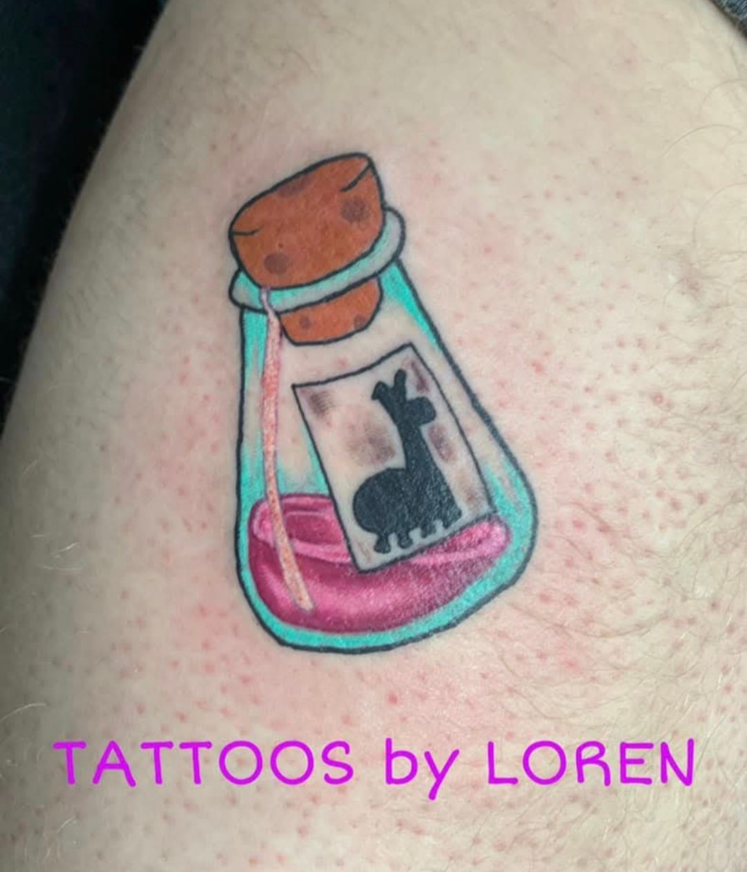 Tattoo of a potion bottle with a llama silhouette inside. Pink liquid, teal bottle, brown cork.