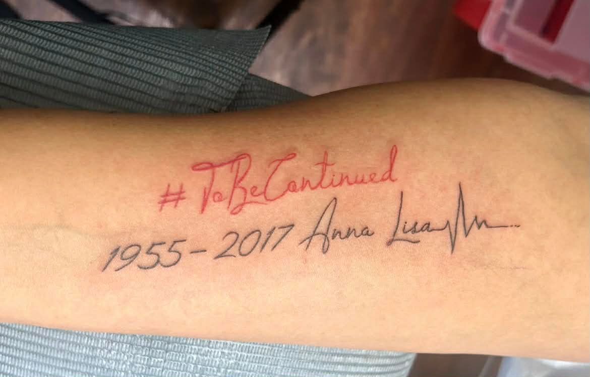 Tattoo on arm reads 