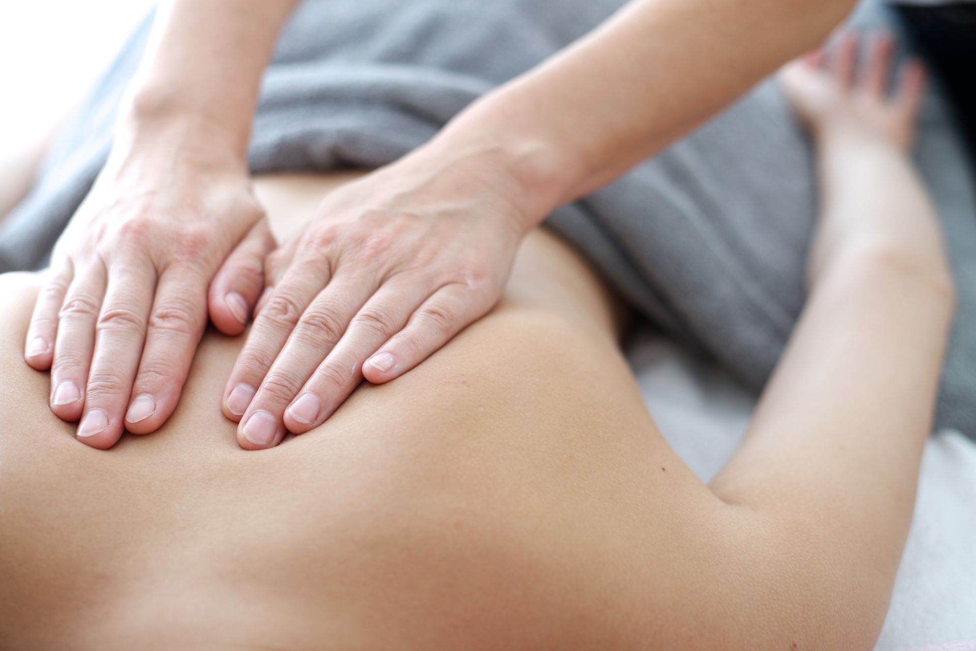 Close up of back massage procedure in spa salon. Close up of back massage procedure in spa salon.