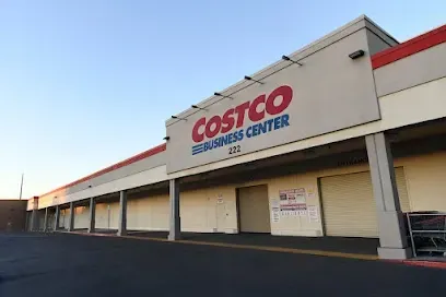 A costco store with a large sign on the side of it.
