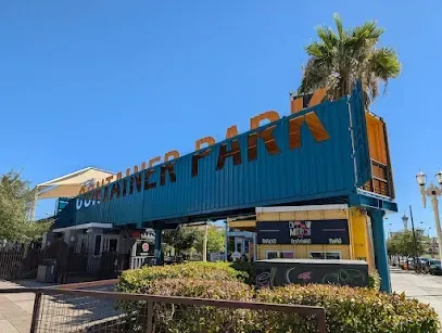 A blue shipping container with the words `` container park '' written on it.