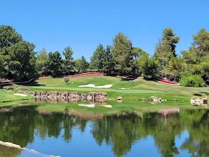 A golf course with a lake in the middle of it
