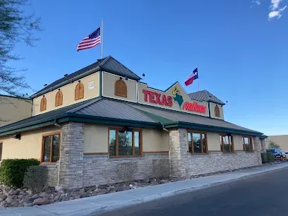 A large building with a texas flag on top of it.