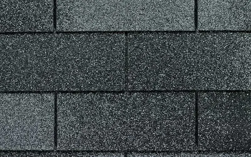Dark gray asphalt roof shingles.