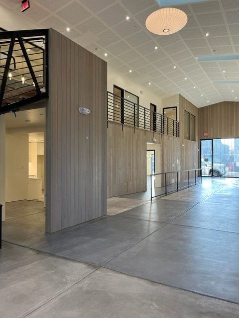 A large room with a lot of windows and a ceiling light