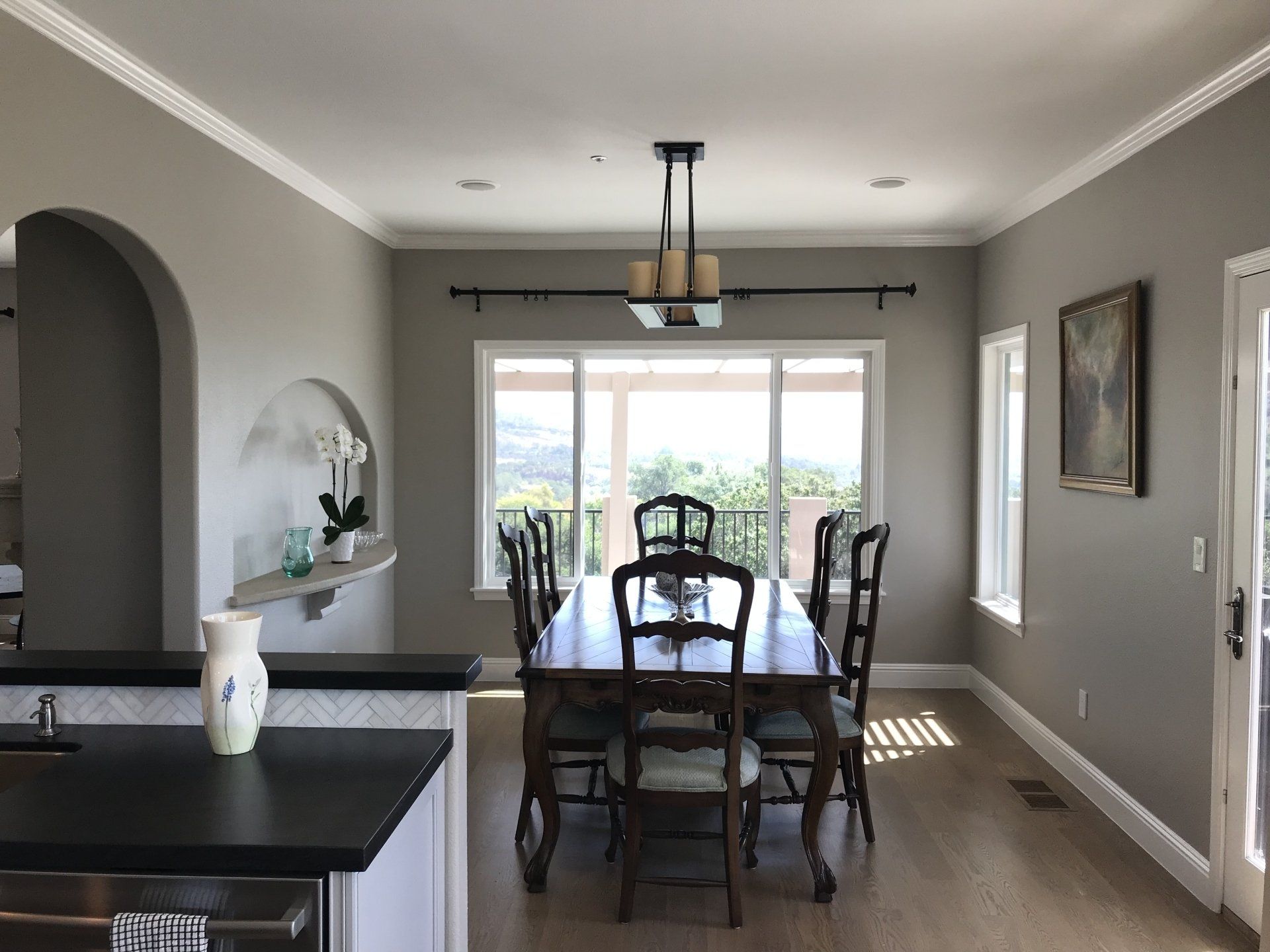A dining room with a large table and chairs