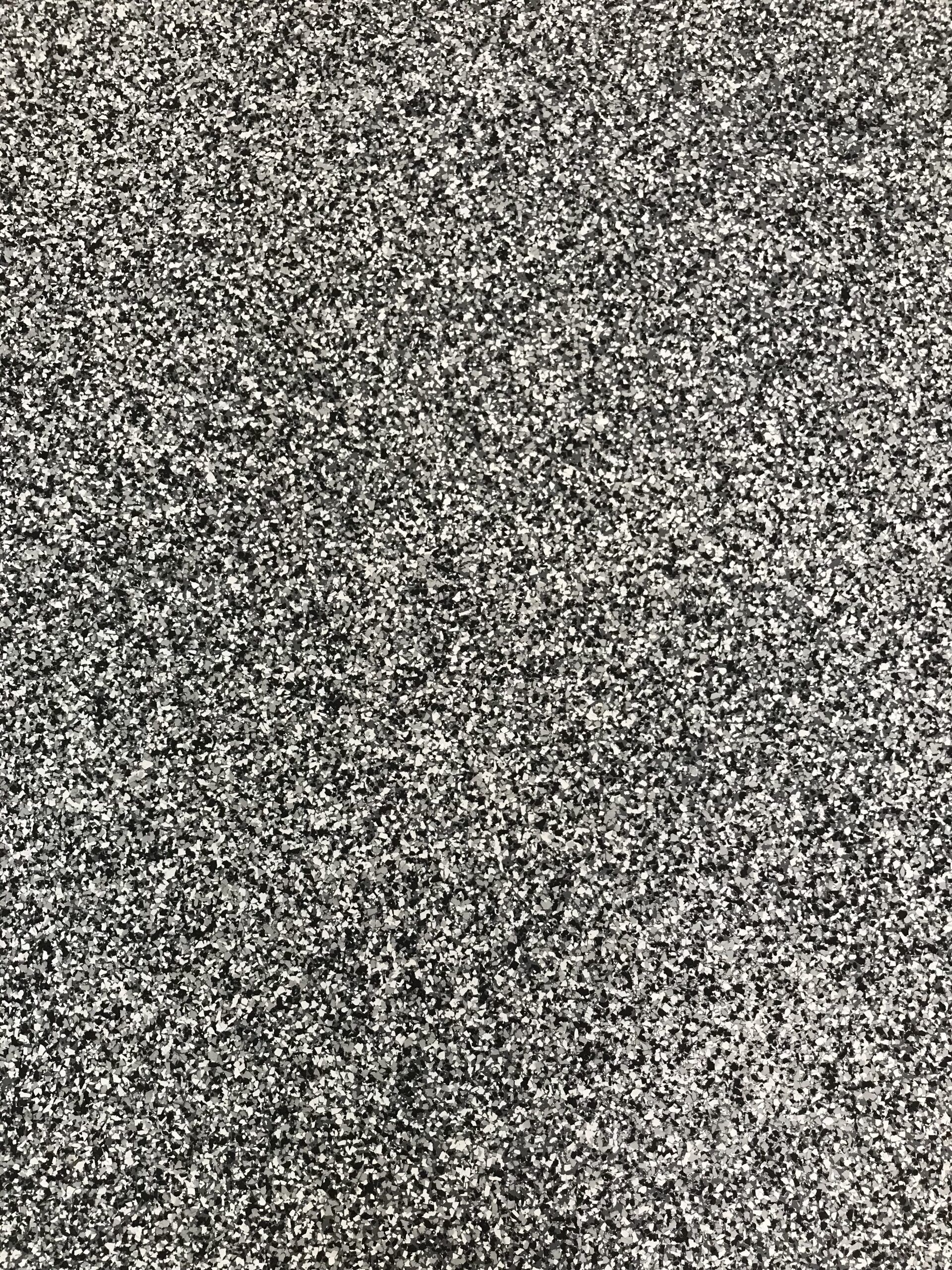 A close up of a gray carpet texture.