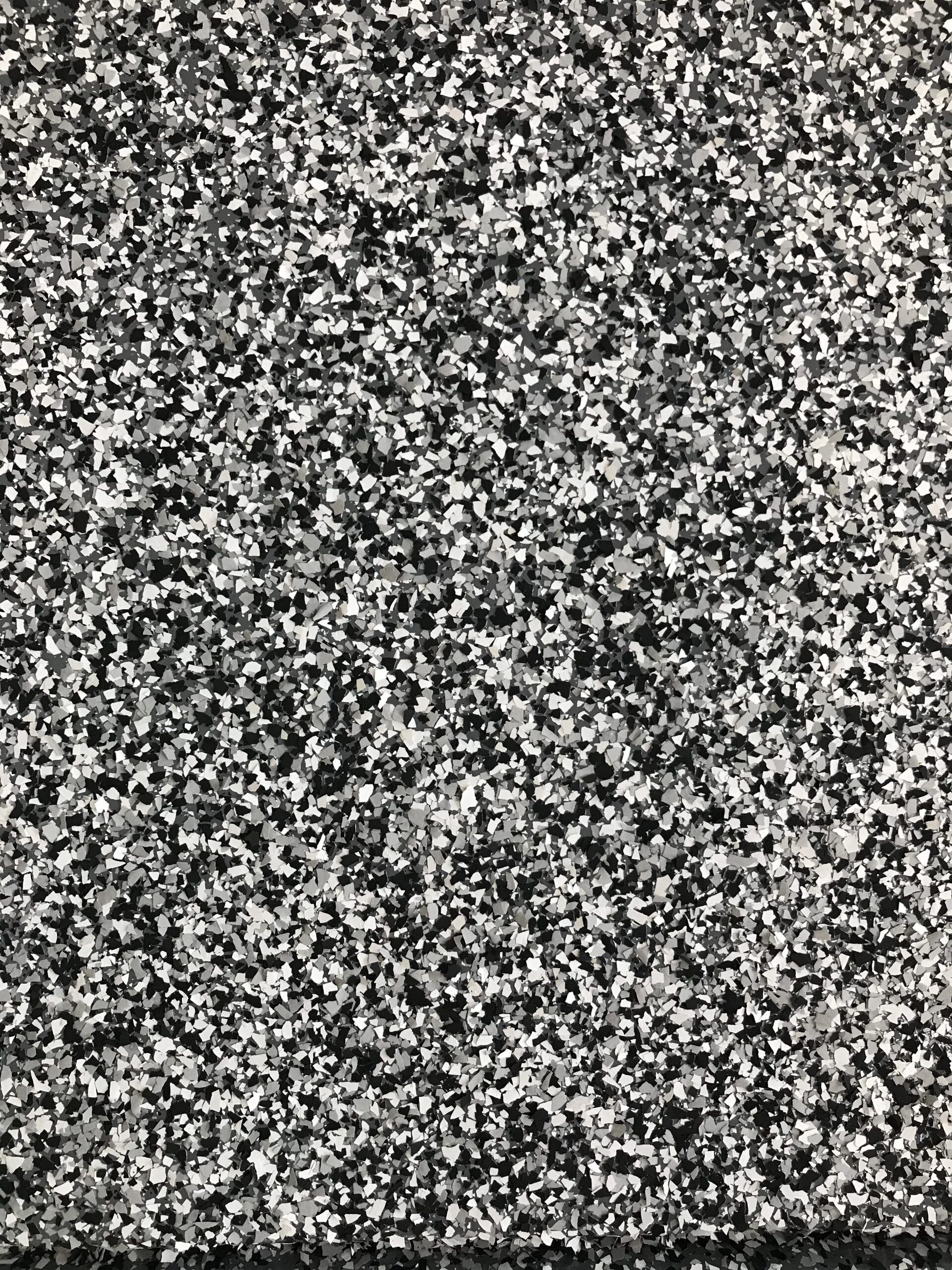 A close up of a black and white carpet texture.