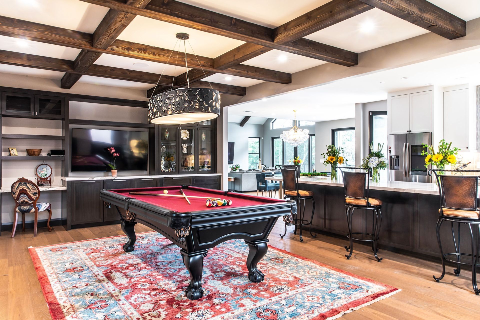 There is a pool table in the middle of the room.