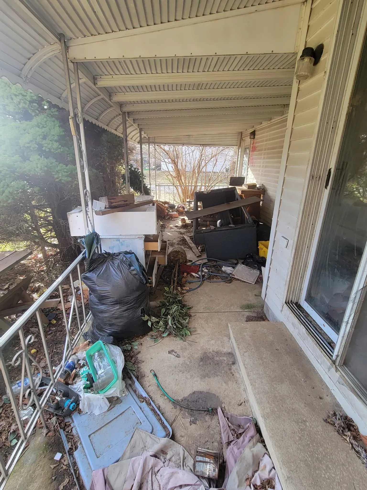 Residential junk removal in Warren OH, crew clearing a basement
