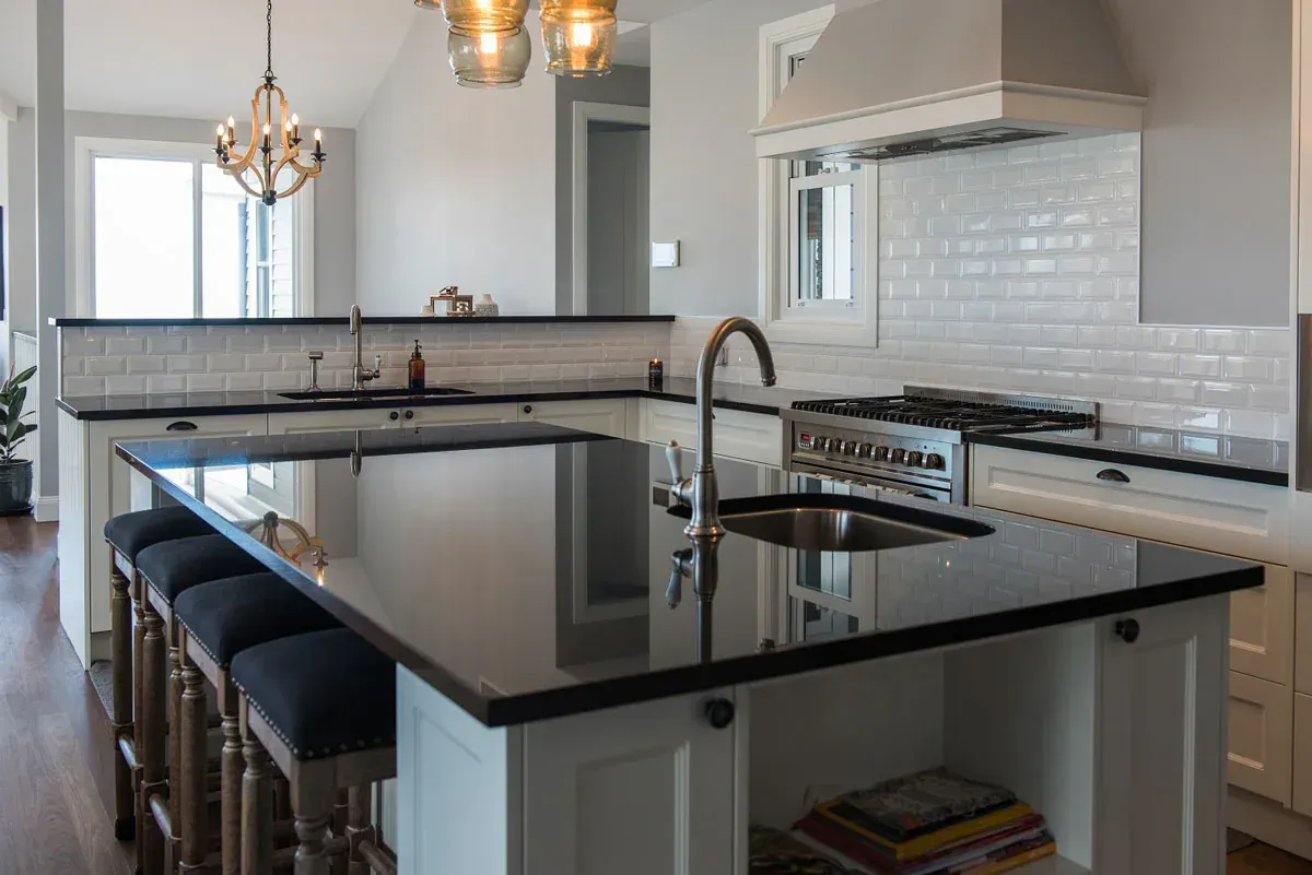 Black Granite Table In The Kitchen With White Cabinets - Coffs Harbour, NSW - G & A Cabinets