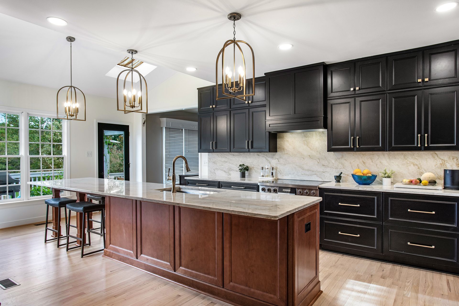 Kitchen Remodeler in Richmond, VA: A kitchen with black cabinets and a large island.