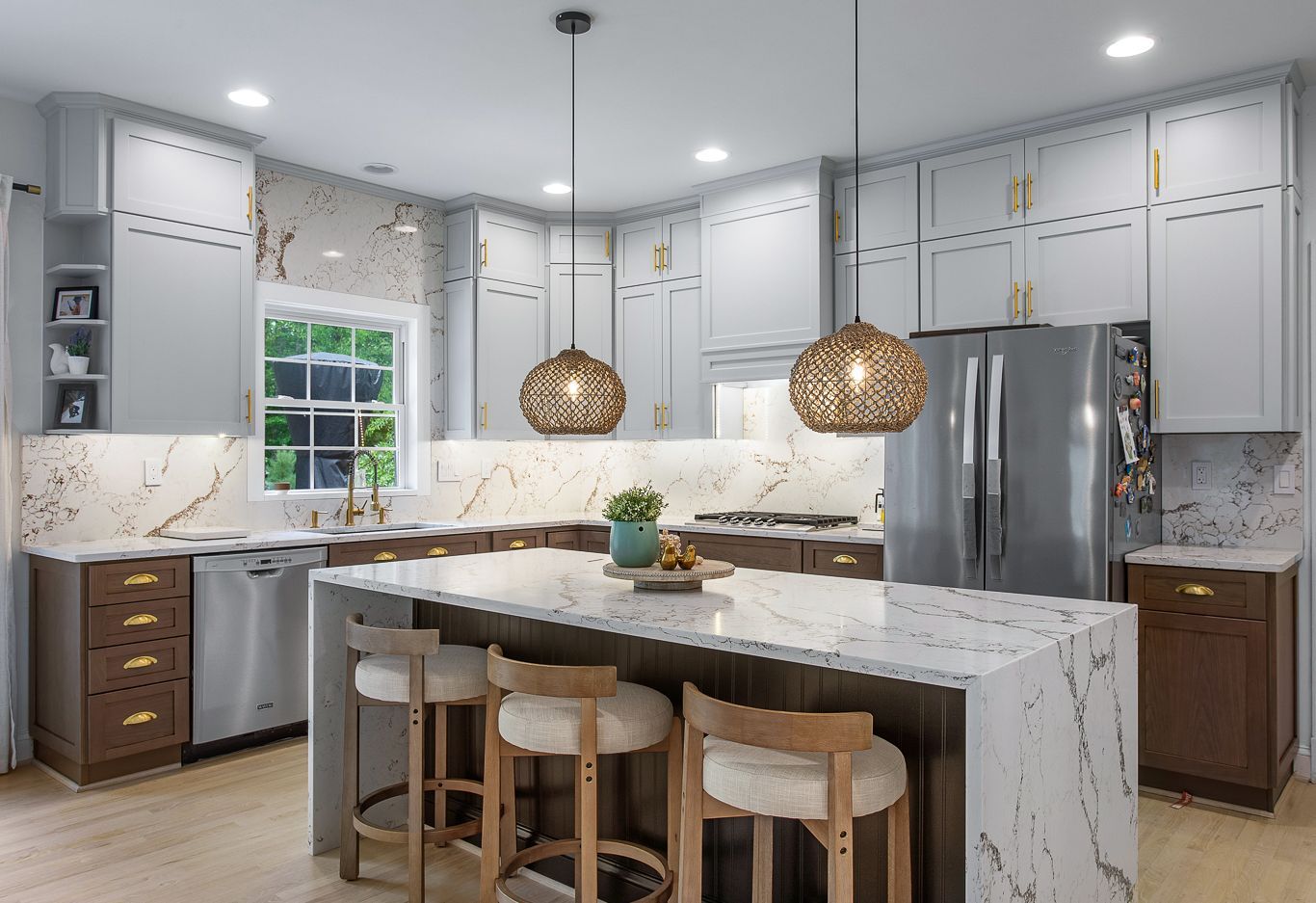 Kitchen Remodeler in Richmond, VA: A kitchen with white cabinets , stainless steel appliances , and a large island.