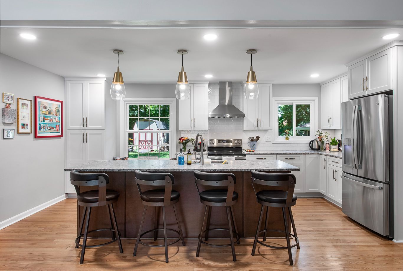 Kitchen Remodeler in Richmond, VA: A kitchen with stainless steel appliances and a large island with stools.