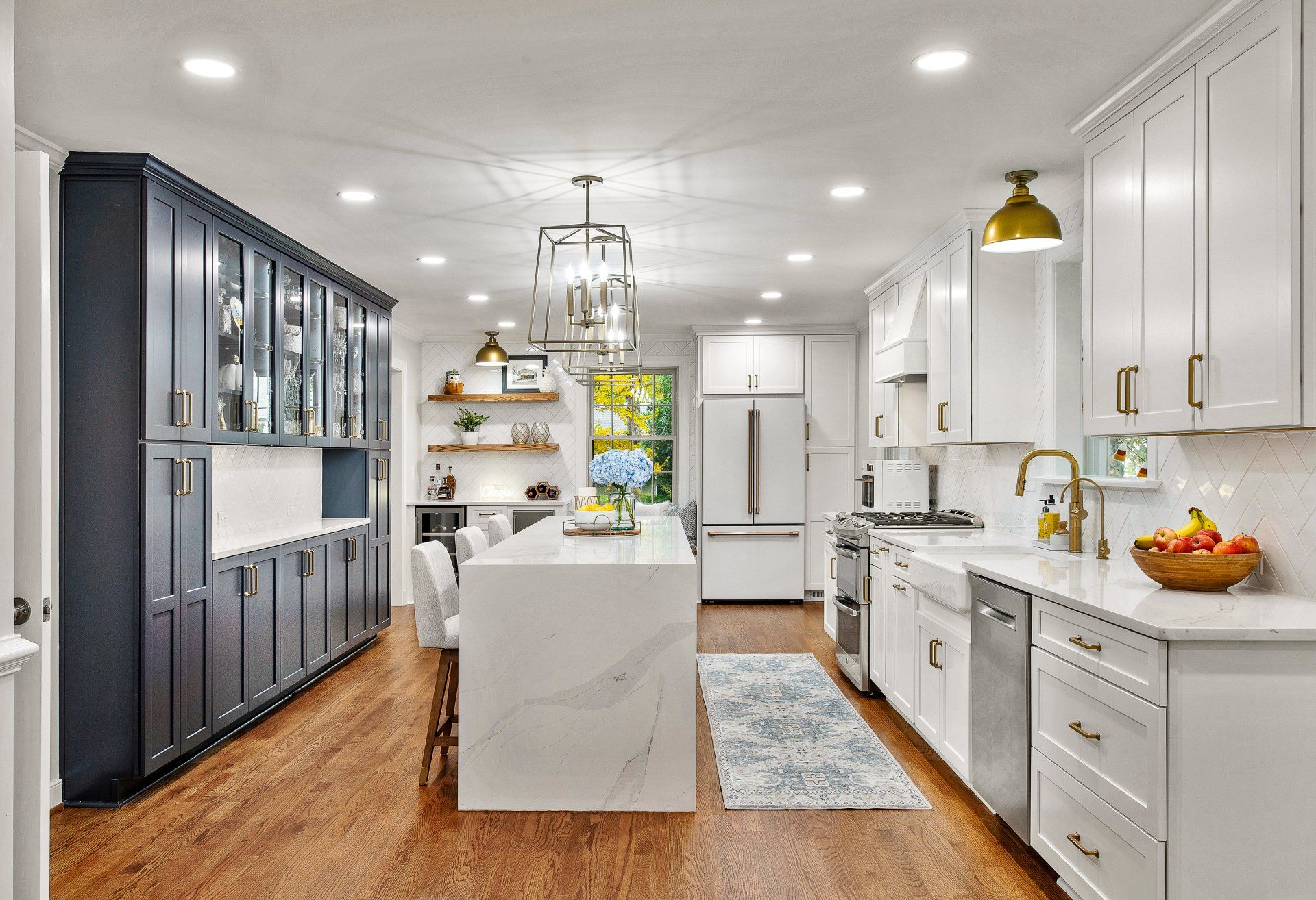 Kitchen Remodeler in Richmond: An after photo of a kitchen with white cabinets and stainless steel appliances