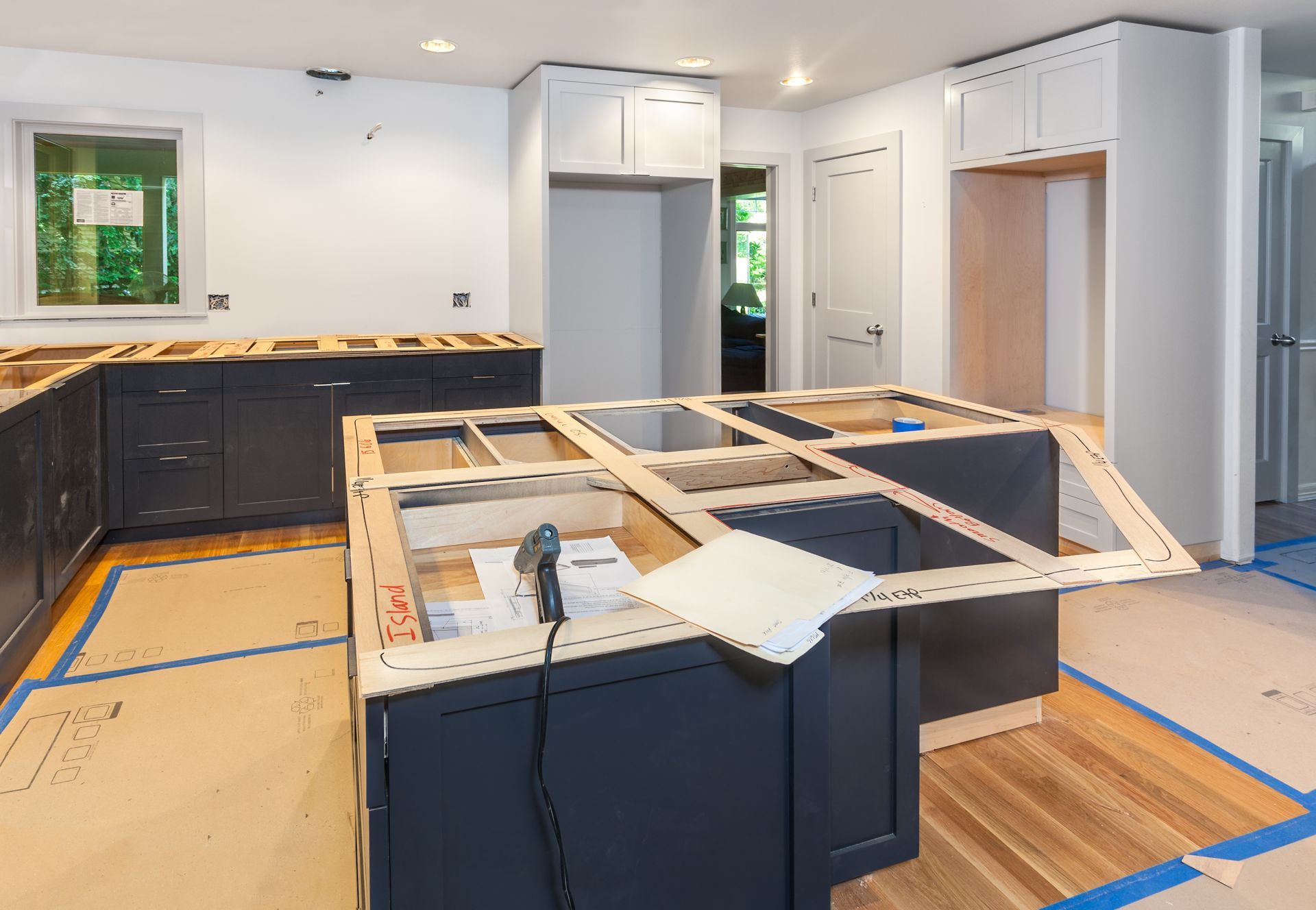 Countertop templates on a navy island during a kitchen remodeling project Countertop templates on a navy island during a kitchen remodeling project