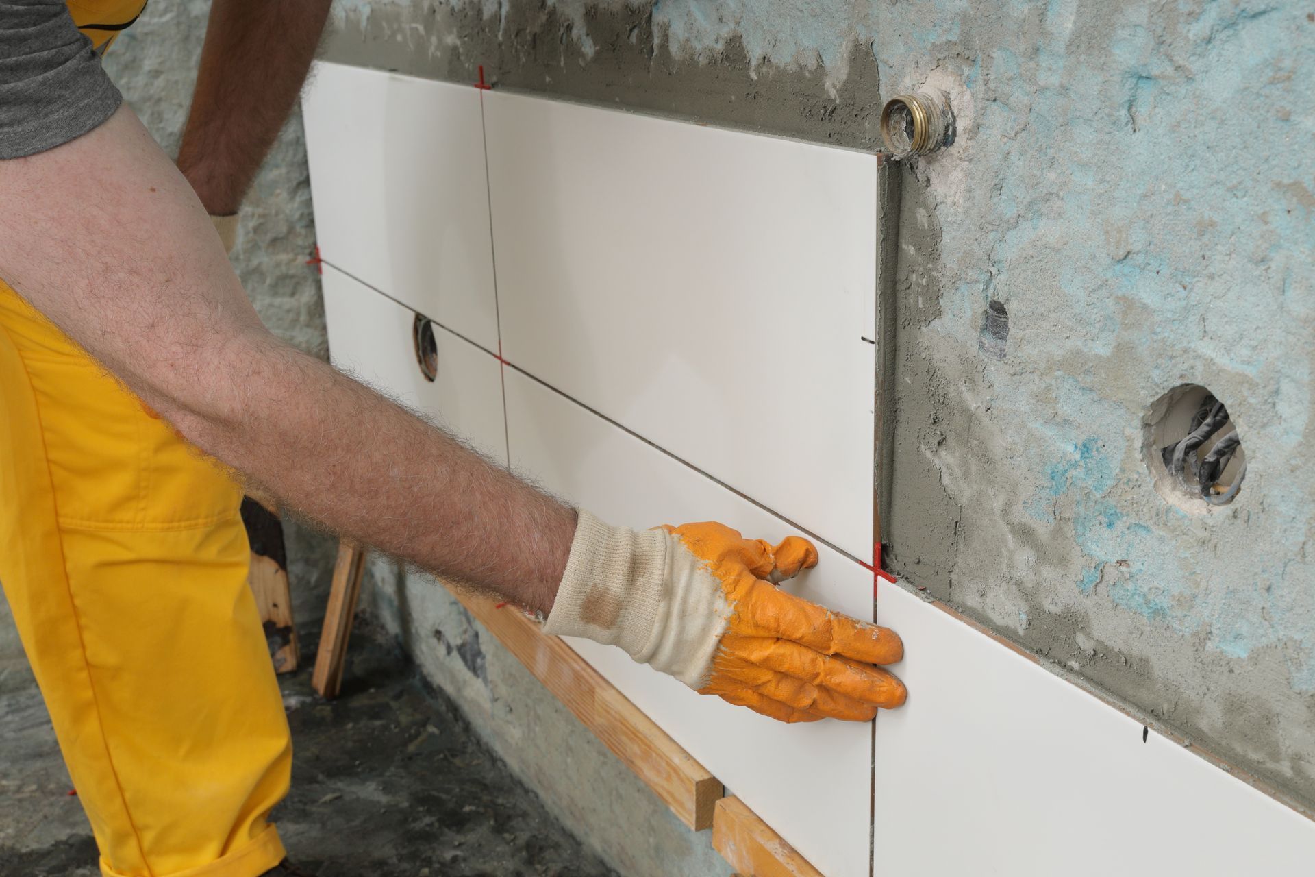 Bathroom remodeling tile installation in progress. Bathroom remodeling tile installation in progress.