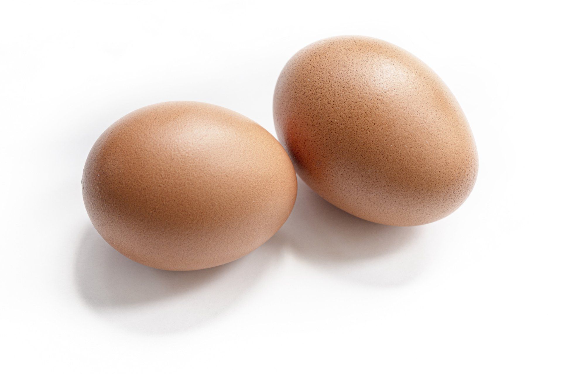 Two Eggs — Muncie, IN — Oxley Softwater Co. Two brown eggs on a white background.