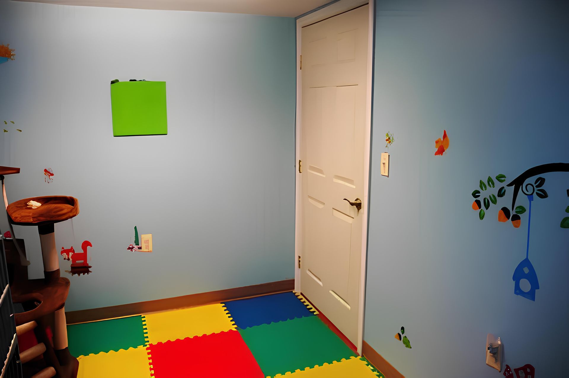 a room with a cat tree and a colorful mat on the floor