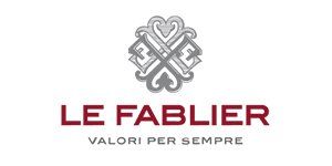 Il logo di Le Fablier, caratterizzato da un elaborato simbolo grigio sopra la scritta rossa 