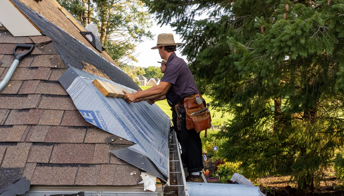 Boalsburg best Amish  roofers working on luxury home