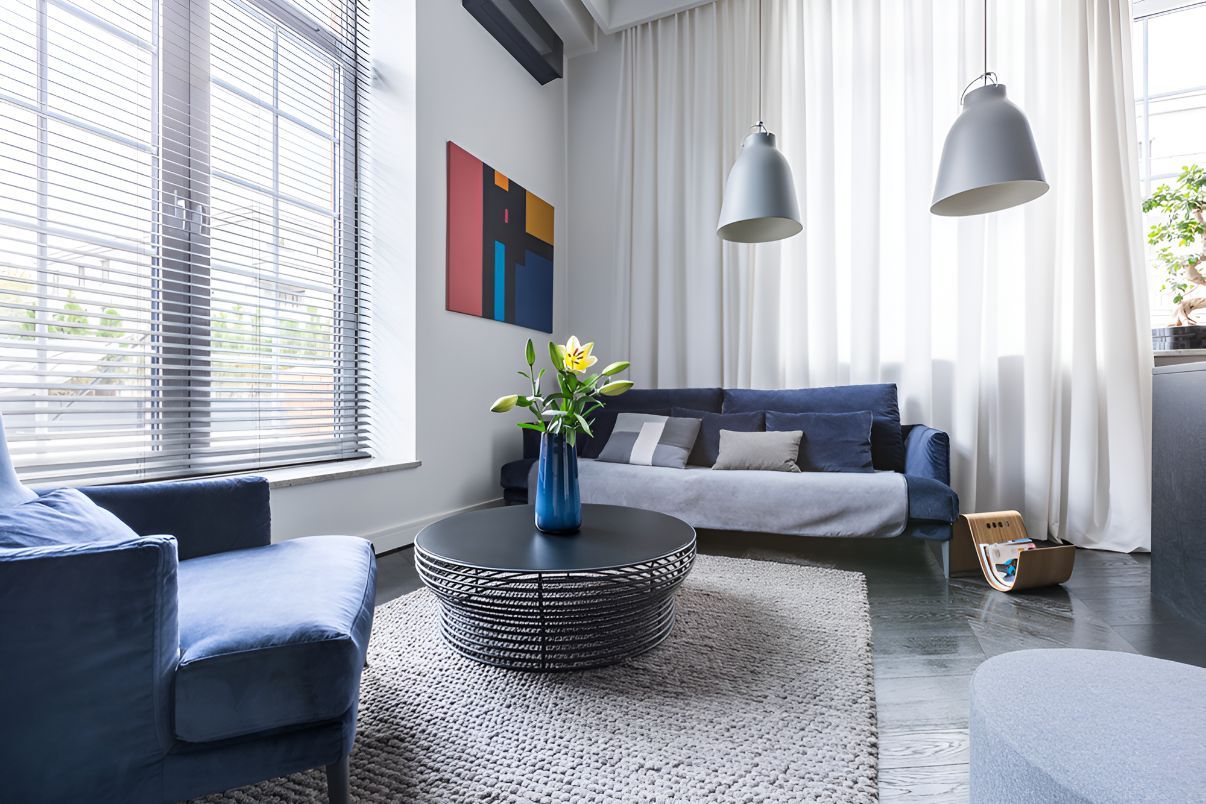 A Living Room With a Couch, Chairs, and a Coffee Table — Newcastle Curtains And Blinds In Warners Bay, NSW