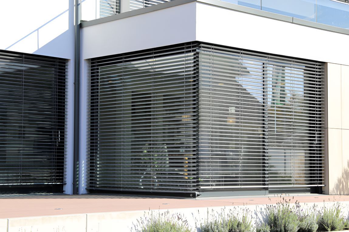 A House With a Lot of Windows and Blinds on It — Newcastle Curtains And Blinds In Merewether, NSW