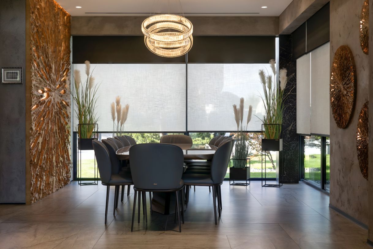 A Dining Room With a Table and Chairs and a Large Window — Newcastle Curtains And Blinds In Belmont, NSW