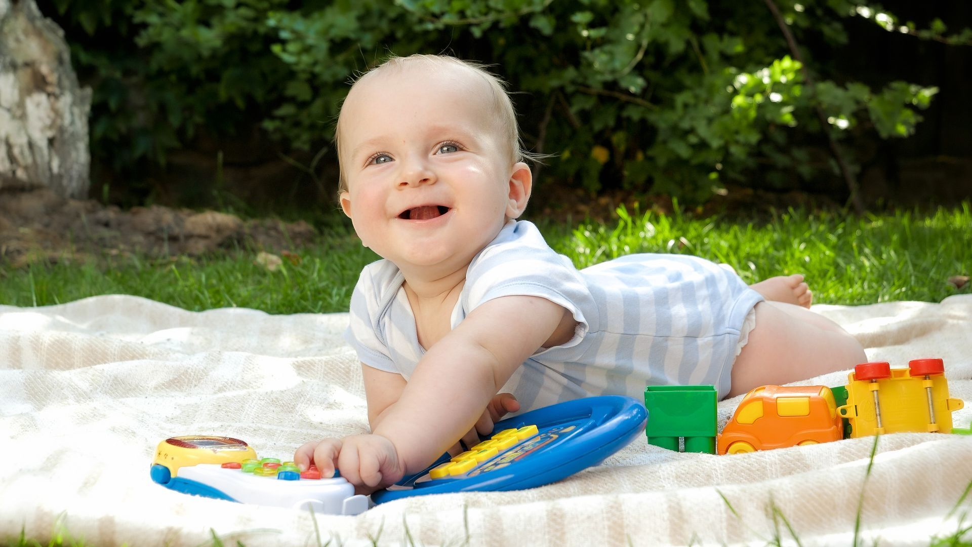 Baby playing on blanket