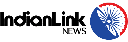 IndianLink News logo with black text and a blue circular emblem featuring the Ashoka Chakra in red and white