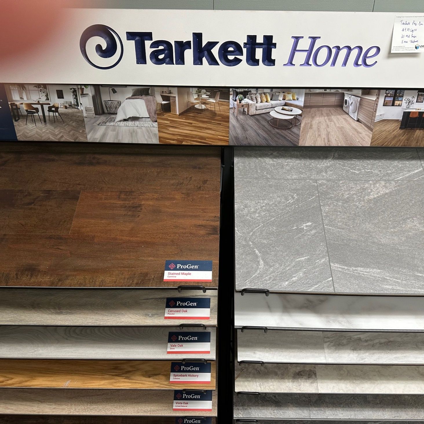 Floor samples from Tarkett Home, wood and stone designs on display.