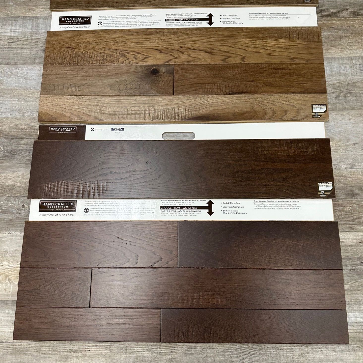 Wooden flooring samples in various shades of brown.