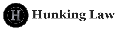 Logo for Hunking Law. Features a black circle with a silver "H" inside, with "Hunking Law" to the right.