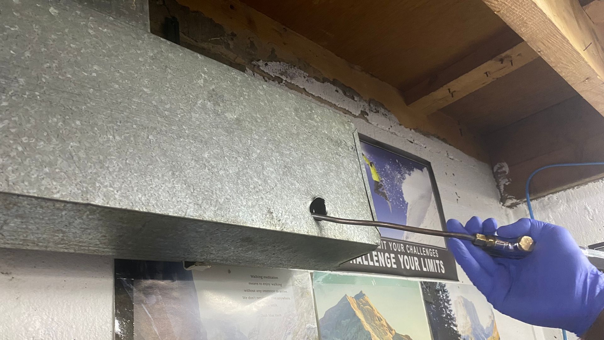 tech using power whip to clean central ducting