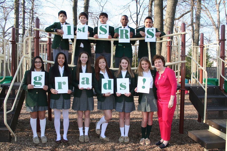 A group of children holding up signs that say 