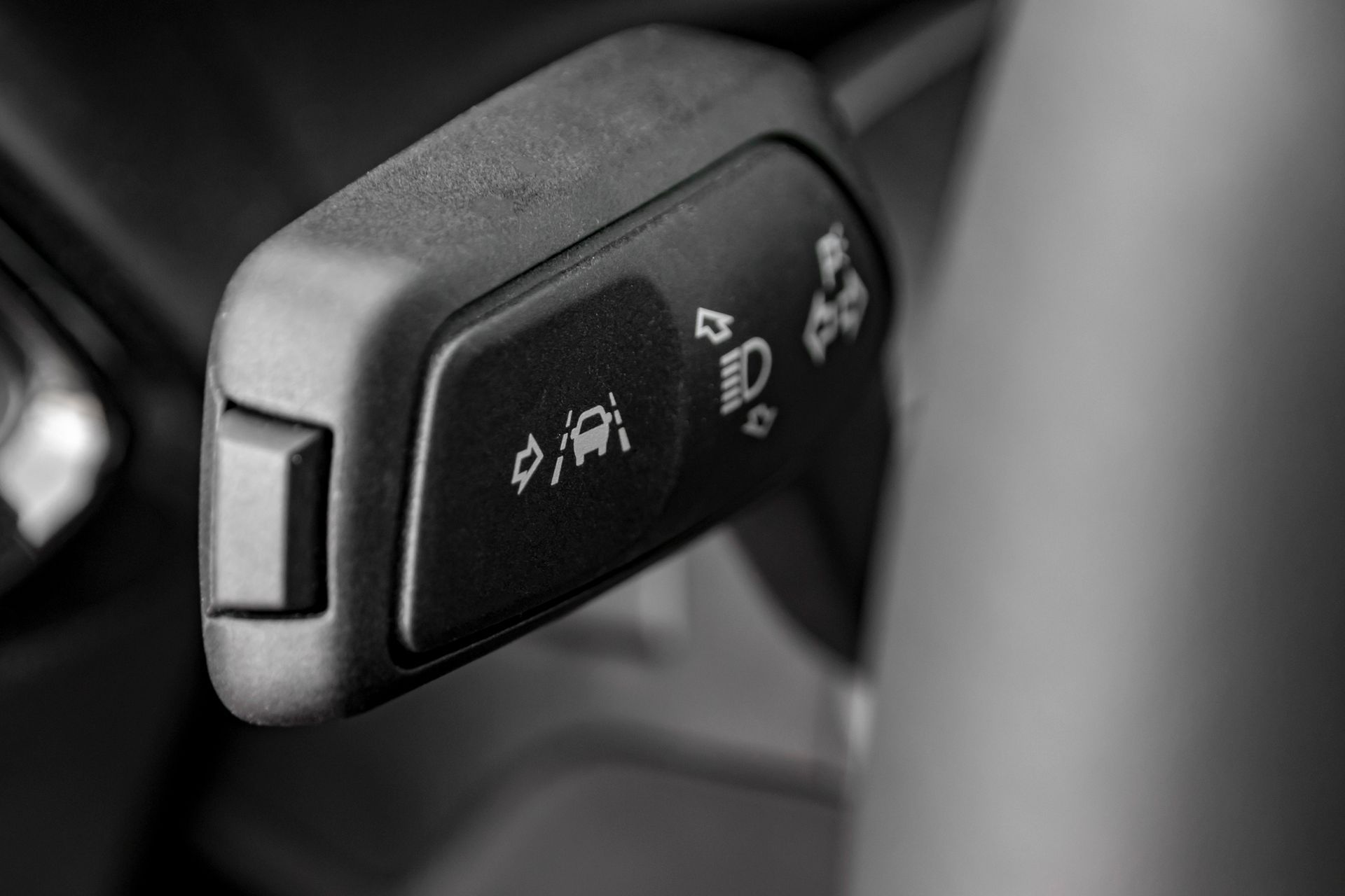 Car interior stalk switch with dashboard icons, likely for lights and wipers