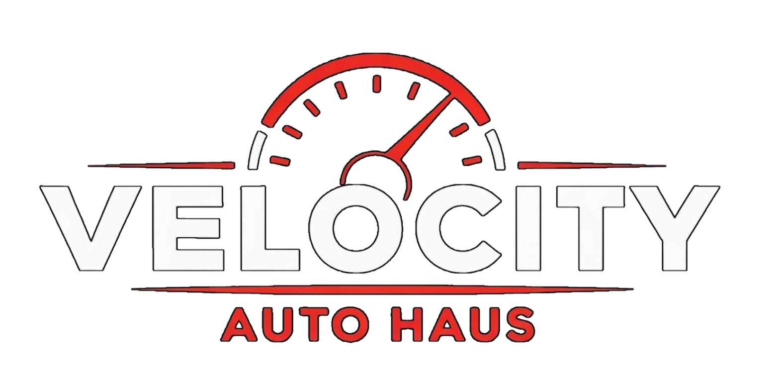 Velocity Auto Haus logo with red speedometer and gray text