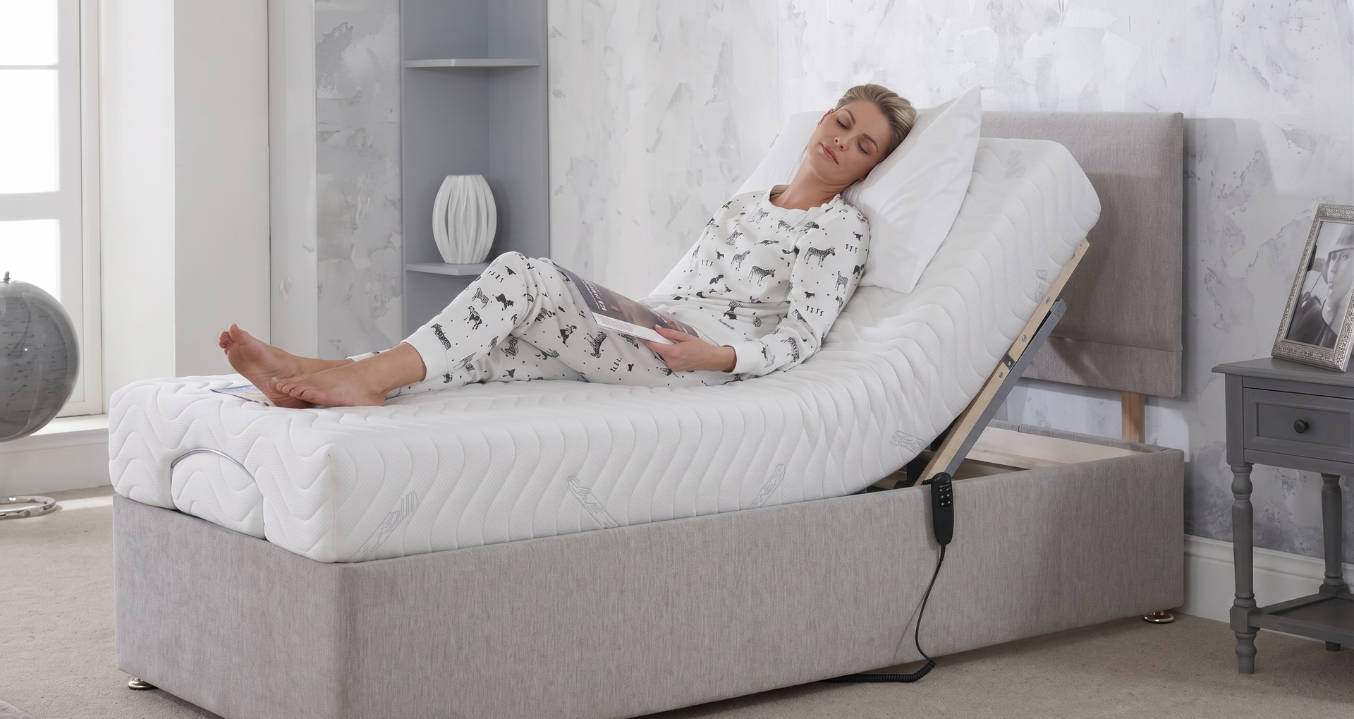 Woman reclining in beige lift chair in front of a window