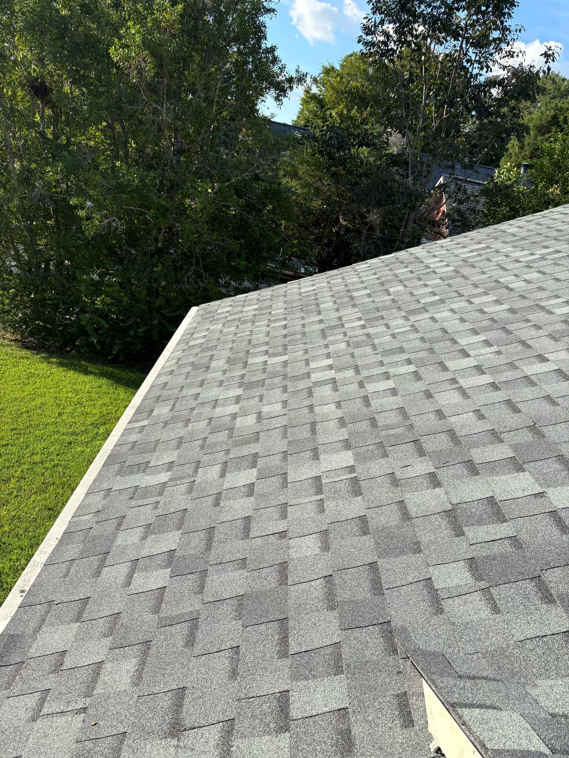 Finished roof replacement on a Charleston area home completed by Charleston Roofs and Windows