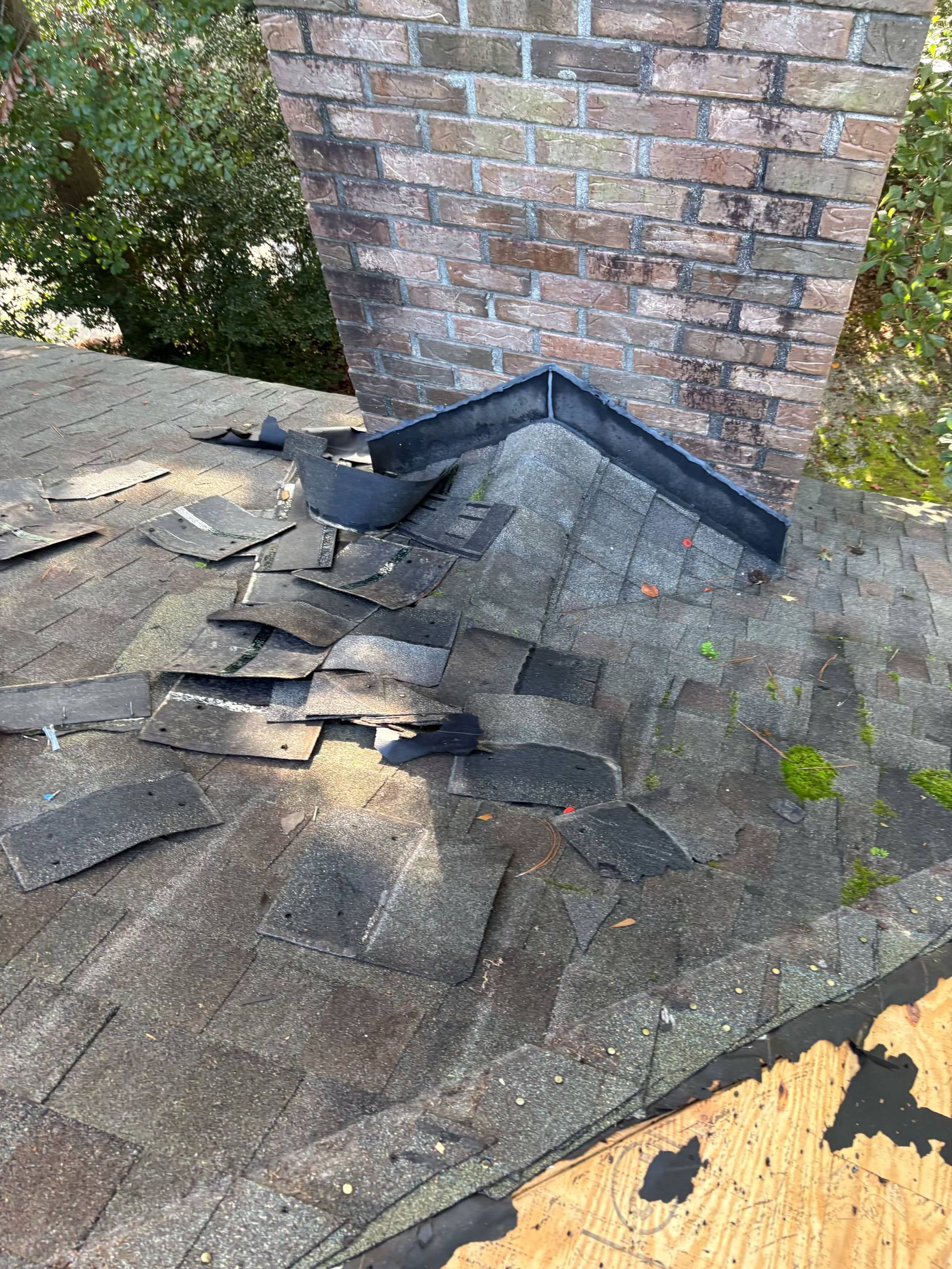A Charleston Roofs and Windows inspection manager reviewing a line-item roof replacement estimate with a Charleston homeowner on a front porch, with a new roof visible overhead. The image represents roof replacement cost in Charleston SC, priced per square for asphalt shingles, metal and flat roofs, with free inspections and 0% financing for 12 months on approved credit from a locally owned roofing company.