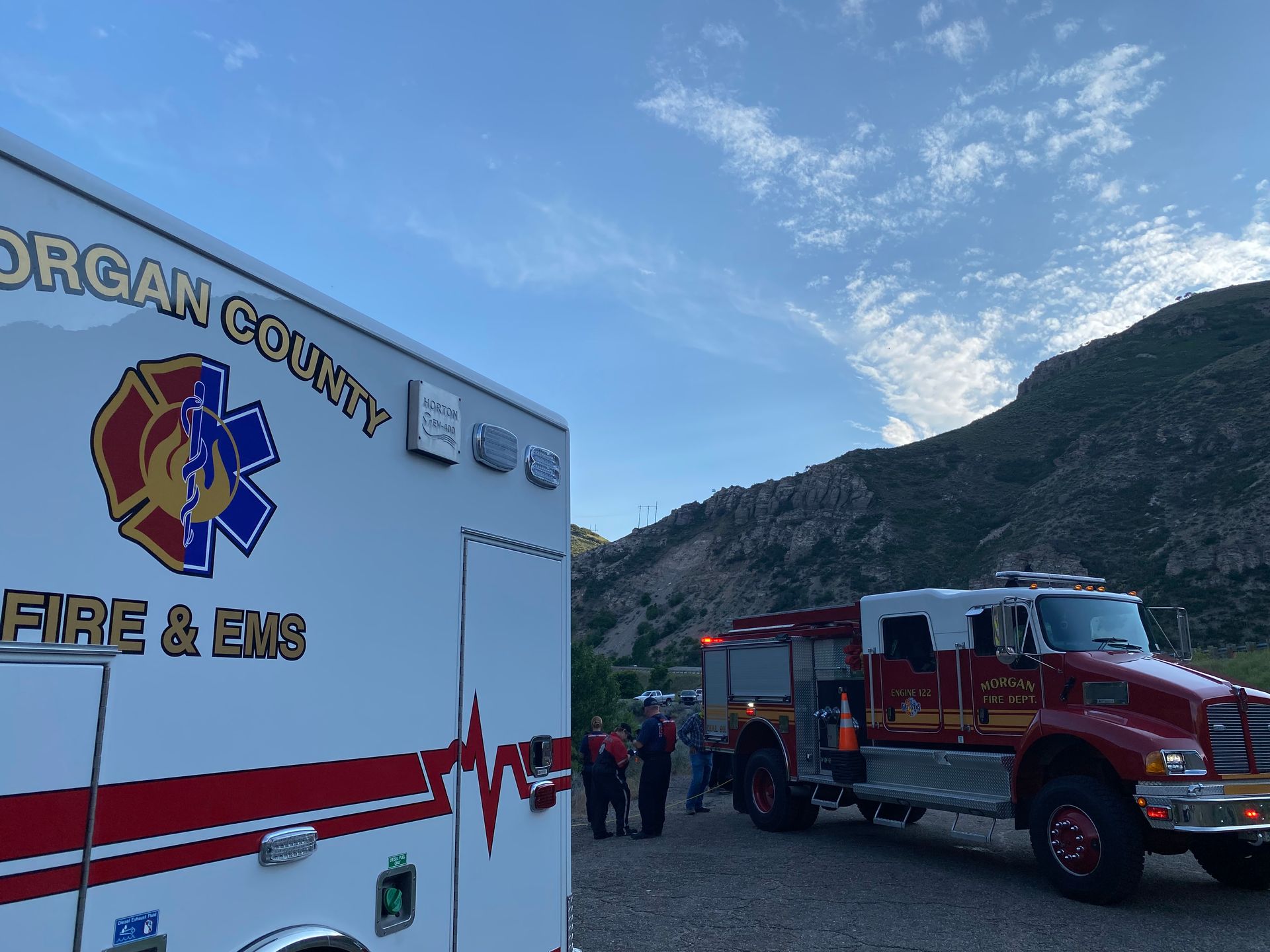 Morgan County Fire & EMS ambulance and fire truck at an outdoor scene.